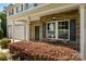 Inviting front porch with brick accents and seating area, perfect for relaxing and enjoying the neighborhood view at 352 Nantucket Way, Rock Hill, SC 29732