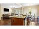 Modern kitchen island featuring granite countertop and stainless steel appliances open to the living room at 352 Nantucket Way, Rock Hill, SC 29732