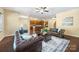 Open-concept living room with hardwood floors, leather sofas, and bright, natural light at 352 Nantucket Way, Rock Hill, SC 29732