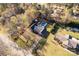 A lovely property showcasing a private in-ground pool, lush landscaping, and proximity to mature trees at 363 Arrowood Ave, Lancaster, SC 29720