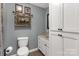 Cozy bathroom with tile floor, toilet, sink, and cabinet storage at 363 Arrowood Ave, Lancaster, SC 29720