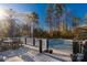 A backyard deck overlooks the pool with views of mature trees and offers a great outdoor space at 363 Arrowood Ave, Lancaster, SC 29720