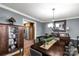 Elegant dining room featuring a dark wood table and a view to the kitchen at 363 Arrowood Ave, Lancaster, SC 29720