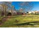 Charming brick home featuring a well maintained front yard with mature trees at 363 Arrowood Ave, Lancaster, SC 29720