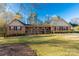 Charming brick home with a welcoming front porch and well-manicured lawn at 363 Arrowood Ave, Lancaster, SC 29720