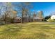 Lovely brick home with inviting front porch, set on a spacious, verdant lawn at 363 Arrowood Ave, Lancaster, SC 29720