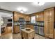 Galley kitchen featuring wooden cabinets, stainless steel appliances, and a butcher block island at 363 Arrowood Ave, Lancaster, SC 29720