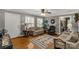 Living room with wood floors, neutral walls, and a decorative rug at 363 Arrowood Ave, Lancaster, SC 29720