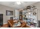 Cozy office with a wooden desk, ample storage shelves, and decor, perfect for a home workspace at 363 Arrowood Ave, Lancaster, SC 29720
