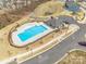 Aerial view of community pool and playground; community buildings and landscaping at 3960 Town Center Rd, Harrisburg, NC 28075