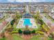Aerial view of community pool area with pool, landscaping, and seating at 3960 Town Center Rd, Harrisburg, NC 28075
