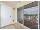 Balcony with sliding glass door and white door, showcasing exterior siding at 3960 Town Center Rd, Harrisburg, NC 28075