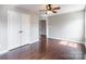 A vacant bedroom features wood flooring and ample closet space at 3960 Town Center Rd, Harrisburg, NC 28075