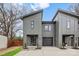 Modern townhome with gray exterior, stylish entry, and garage blending contemporary design and charm at 431 Norris Ave, Charlotte, NC 28206