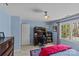 Blue bedroom with carpet floors, a desk, and a window at 4501 Mullens Ford Rd, Charlotte, NC 28226