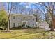 Charming home featuring classic architecture, gray shingles, manicured lawn, and a three-car garage at 4501 Mullens Ford Rd, Charlotte, NC 28226