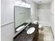 Bathroom featuring a large mirror, granite counters, wood cabinets, and a shower-tub combination at 5006 Brodie Ln, Fort Mill, SC 29707