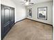 Simple bedroom with carpet, closet, two windows and neutral walls at 5006 Brodie Ln, Fort Mill, SC 29707