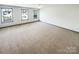 Spacious bedroom with neutral carpet and ample natural light from multiple windows offering a bright, airy feel at 5006 Brodie Ln, Fort Mill, SC 29707