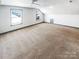Bright attic bedroom featuring neutral carpet, ample natural light from multiple windows and ceiling fan at 5006 Brodie Ln, Fort Mill, SC 29707