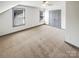 Attic bedroom space with neutral carpet and multiple windows, offering ample natural light at 5006 Brodie Ln, Fort Mill, SC 29707