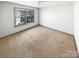 Empty bedroom with neutral carpet, ample natural light, and modern ceiling fan at 5006 Brodie Ln, Fort Mill, SC 29707