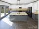 Modern kitchen with stainless steel appliances, a large island, and plenty of cabinet space at 5006 Brodie Ln, Fort Mill, SC 29707