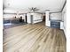 Expansive living room with hardwood floors, open concept design, and modern ceiling fan at 5006 Brodie Ln, Fort Mill, SC 29707