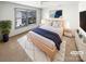 Cozy main bedroom with a comfortable bed, natural light, and stylish decor at 5006 Brodie Ln, Fort Mill, SC 29707