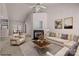 Bright living room featuring a fireplace, ceiling fan, and comfortable seating area at 532 Knighton Hill Rd, Rock Hill, SC 29732