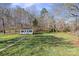 View of a backyard with a shed and plenty of yard space at 5405 Berrywood Ln, Monroe, NC 28110