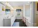Bright bathroom features a double vanity, soaking tub, and tile floors offering style and comfort at 5405 Berrywood Ln, Monroe, NC 28110