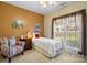 Cozy bedroom with natural light, features a comfortable bed and classic decor, creating a relaxing atmosphere at 5405 Berrywood Ln, Monroe, NC 28110