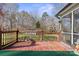 Large wooden deck with railing overlooking the backyard at 5405 Berrywood Ln, Monroe, NC 28110