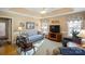 Comfortable den featuring tray ceiling, plush seating, and natural light at 5405 Berrywood Ln, Monroe, NC 28110