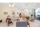 Bright living room with ceiling fans, neutral walls and carpet throughout at 5405 Berrywood Ln, Monroe, NC 28110