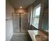 Bright bathroom features glass enclosed shower and modern vanity with quartz countertop at 586 N Sparkleberry St, Chester, SC 29706