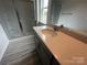 Bathroom featuring modern vanity with single sink, quartz countertop and enclosed shower at 586 N Sparkleberry St, Chester, SC 29706