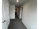 Upstairs hallway with carpet and white doors on either side at 586 N Sparkleberry St, Chester, SC 29706
