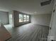 Bright, open living room with luxury vinyl plank flooring and sliding glass door at 586 N Sparkleberry St, Chester, SC 29706