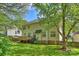 Exterior of home featuring a spacious, green backyard at 6008 Nuthatch Ct, Charlotte, NC 28277