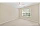 Well-lit bedroom with neutral walls, carpet, and window with blinds at 6008 Nuthatch Ct, Charlotte, NC 28277