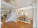 Elegant dining room with hardwood floors, chandelier, and wainscoting for sophisticated gatherings at 6008 Nuthatch Ct, Charlotte, NC 28277