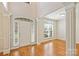 Bright foyer with hardwood floors, white trim, and an open layout, creating a welcoming atmosphere at 6008 Nuthatch Ct, Charlotte, NC 28277