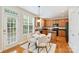 Charming eat-in kitchen with wood cabinets, stainless appliances, and a door leading to the outdoor space at 6008 Nuthatch Ct, Charlotte, NC 28277