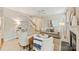 Well-lit living room with fireplace, comfortable seating, and stylish decor, adjacent to the staircase and entry at 6008 Nuthatch Ct, Charlotte, NC 28277