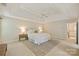 Lovely main bedroom with a neutral palette, tray ceiling, bedside tables, and carpeted floors at 6008 Nuthatch Ct, Charlotte, NC 28277