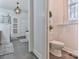 Modern bathroom with walk in shower, tub, and stylish chandelier lighting at 704 N Main Ave, Newton, NC 28658