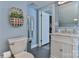 Bright bathroom with vanity, toilet, and a mirror at 704 N Main Ave, Newton, NC 28658