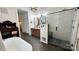 Serene bathroom with a luxurious soaking tub and a glass enclosed shower at 704 N Main Ave, Newton, NC 28658